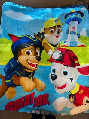 Paw Patrol cartoon design 40"W x 50"L Soft, warm and cuddly Great for travel or nap Fits twin size bed Paw